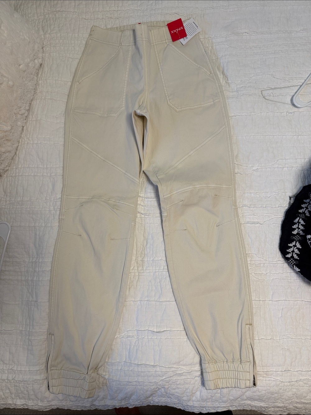 Women’s Cream Jogger Pants with ankle zippers and cute stitching on knee.
